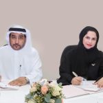 Fatma Salem and Hamad Taryam Al Shamsi signing the MoU