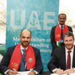 Capt. Maktoum Al Houqani and Mike Fitzpatrick sign the landmark agreement, in the presence of HE Dr. Abdullah Belhaif Al Nuaimi