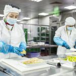 EAS Catering Chefs preparing food boxes for humanitarian distribution