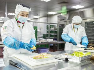 EAS Catering Chefs preparing food boxes for humanitarian distribution