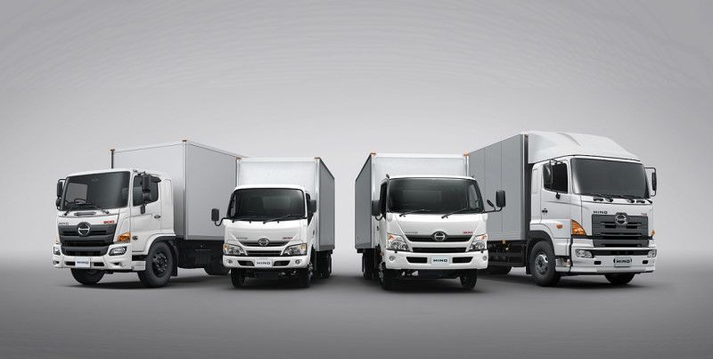 A line-up of HINO commercial vehicles