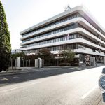 The new Patek Philippe Manufacture Building and (inset) the commemorative Ref. 6007A-001 Calatrava