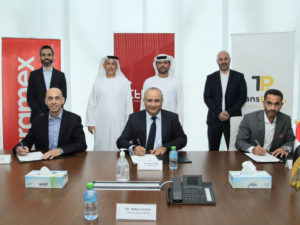 L to R-Bashar Obeid, Amer Kakish and Alaa Hawari ink the deal