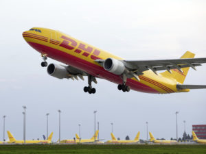 A DHL Express freighter in flight