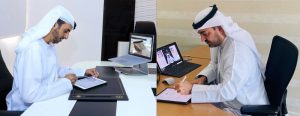 Juma Bin Humaidan and Arif Alharmi Albastaki, signing the agreement