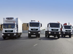 An array of MAN commercial trucks