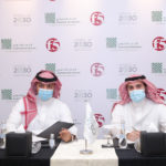 Mamduh Allam and Asim Saud AlJammaz at the signing ceremony