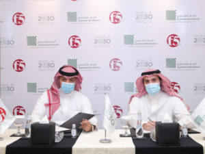 Mamduh Allam and Asim Saud AlJammaz at the signing ceremony