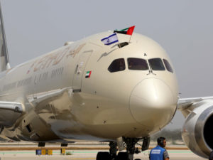 Etihad's first scheduled flight to Tel Aviv with flags waved from the cockpit