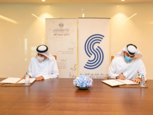 The signing ceremony between Salah Salim Almahmoud (left) and Amin Al Zarouni